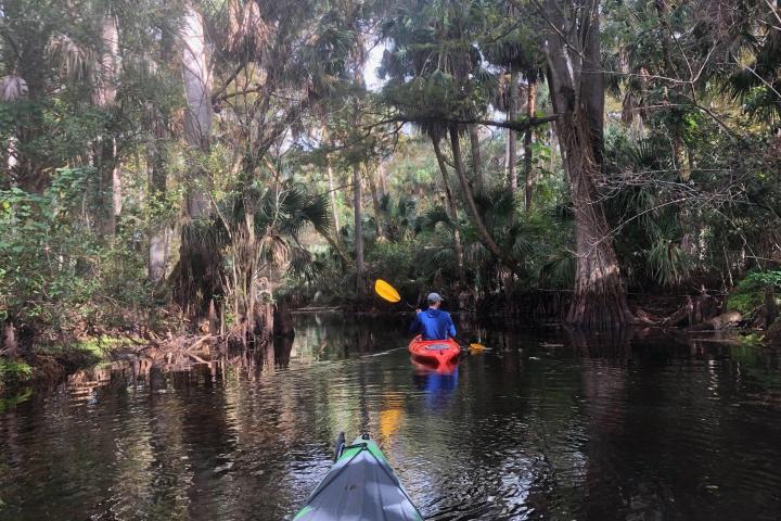 a group of people on a raft in a body of water